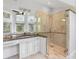Spacious bathroom featuring granite countertops, a glass shower enclosure, and vanity at 1415 Brumley Rd, Chuluota, FL 32766