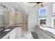 Large bathroom featuring granite countertops, dual sinks, tile flooring, and a glass shower at 1415 Brumley Rd, Chuluota, FL 32766
