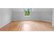 Spacious bedroom featuring hardwood floors, and lots of natural light at 1415 Brumley Rd, Chuluota, FL 32766