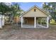 Large carport attached to the rear of the house with ample covered space at 1415 Brumley Rd, Chuluota, FL 32766