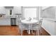 Eat-in kitchen featuring an eat-in table, stainless steel appliances and white cabinetry at 1415 Brumley Rd, Chuluota, FL 32766
