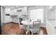 Eat-in kitchen featuring an eat-in table, stainless steel appliances and white cabinetry at 1415 Brumley Rd, Chuluota, FL 32766
