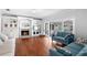 Bright living room boasts a fireplace, hardwood floors, and built-in shelving at 1415 Brumley Rd, Chuluota, FL 32766