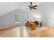 Bright office featuring wood floors, a ceiling fan, and a built in desk at 1415 Brumley Rd, Chuluota, FL 32766