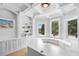 Bright office with custom built-ins, tray ceilings, and natural light from surrounding trees at 1415 Brumley Rd, Chuluota, FL 32766