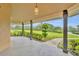 Covered patio offering a relaxing outdoor space with views of the landscaped backyard at 1415 Brumley Rd, Chuluota, FL 32766