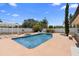 Relaxing backyard pool area featuring a white pergola and lush landscaping at 1415 Brumley Rd, Chuluota, FL 32766