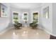 Cozy sitting area with ample natural light from three windows and comfortable seating arrangements at 1415 Brumley Rd, Chuluota, FL 32766