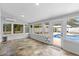 Spacious sunroom with tile flooring and multiple windows overlooking the pool at 1415 Brumley Rd, Chuluota, FL 32766