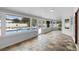 Bright sunroom with tile flooring and views of the outdoor pool area at 1415 Brumley Rd, Chuluota, FL 32766
