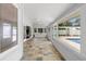 Large sunroom featuring tile floors, access to the backyard pool area, and ample windows at 1415 Brumley Rd, Chuluota, FL 32766