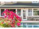 The backyard offers beautiful colorful flowers and a tranquil pool view at 1415 Brumley Rd, Chuluota, FL 32766