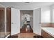Open bathroom layout with a tiled shower, soaking tub, and hardwood floors at 15210 Montesino Dr, Orlando, FL 32828