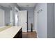 Bright bathroom featuring a double door closet, neutral paint, and tile floor at 15210 Montesino Dr, Orlando, FL 32828