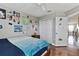 Cozy bedroom featuring a wooden bed frame, laminated floors and decor reflecting a fun personality at 15210 Montesino Dr, Orlando, FL 32828