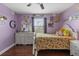 Bright bedroom features a pretty dresser, decorative walls and a ceiling fan for added comfort at 15210 Montesino Dr, Orlando, FL 32828