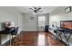 Versatile bonus room with hardwood floors, a ceiling fan, and plenty of natural light at 15210 Montesino Dr, Orlando, FL 32828