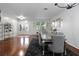 Elegant dining room featuring a modern table set on a hardwood floor with a rug at 15210 Montesino Dr, Orlando, FL 32828
