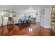 Elegant dining room with hardwood floors, modern decor, and a stylish gray dining set at 15210 Montesino Dr, Orlando, FL 32828