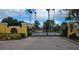 Elegant gated community entrance with decorative ironwork and brick pavers offers security and curb appeal at 15210 Montesino Dr, Orlando, FL 32828