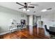 Bright living area with hardwood floors, modern lighting, and neutral paint at 15210 Montesino Dr, Orlando, FL 32828