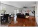Open concept living area with a cozy seating area and rich hardwood flooring at 15210 Montesino Dr, Orlando, FL 32828