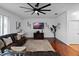 Comfortable living room featuring a large rug, modern décor, and hardwood floors at 15210 Montesino Dr, Orlando, FL 32828