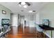 Open living space with hardwood floors and a view of other rooms at 15210 Montesino Dr, Orlando, FL 32828