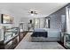 Grey bedroom with a shag rug, elegant decor and plenty of natural light at 15210 Montesino Dr, Orlando, FL 32828