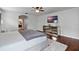 Bright bedroom with a TV, hardwood floors, and white walls at 15210 Montesino Dr, Orlando, FL 32828