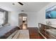 Bedroom featuring TV, dark hardwood floors, and doorway to bath at 15210 Montesino Dr, Orlando, FL 32828