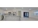 Open-concept kitchen with custom cabinetry, granite countertops, and stainless steel appliances at 16742 Se 165Th Ave, Weirsdale, FL 32195