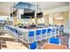 Bar and lounge area featuring a long counter with high chairs and several TVs at 197 Jetty Way, Davenport, FL 33897