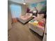 Charming bedroom featuring dual beds with princess themed bedding and mural at 197 Jetty Way, Davenport, FL 33897