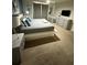 Bright bedroom featuring a king bed, modern furniture, and a serene atmosphere for a restful retreat at 197 Jetty Way, Davenport, FL 33897