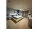 Cozy bedroom featuring neutral decor, a platform bed, and a comfortable gray duvet at 197 Jetty Way, Davenport, FL 33897