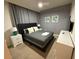 Cozy bedroom showcasing a plush bed, stylish decor, and soft lighting for a relaxing ambiance at 197 Jetty Way, Davenport, FL 33897