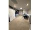 Spacious bonus room with carpeted floors, air hockey table, desk, and unique wall art at 197 Jetty Way, Davenport, FL 33897