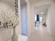 Inviting foyer features neutral tones, a decorative mirror and staircase access to the upper level at 197 Jetty Way, Davenport, FL 33897