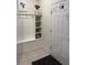 Inviting entryway featuring a built-in bench with storage and a convenient coat rack at 197 Jetty Way, Davenport, FL 33897