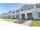 Charming townhomes feature two-story construction with landscaped lawns, sidewalks, and individual entrances at 197 Jetty Way, Davenport, FL 33897