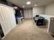 Spacious game room featuring carpet floors, an air hockey table, and a fun, themed accent wall at 197 Jetty Way, Davenport, FL 33897