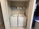 Laundry room including a washer, a dryer, some towels, and an iron available at 197 Jetty Way, Davenport, FL 33897