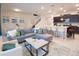 Open concept living area with a living room, a kitchen island with seating, and a dining table at 197 Jetty Way, Davenport, FL 33897