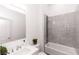 Modern bathroom with gray tiled shower, sleek fixtures, and contemporary vanity at 2065 East Pkwy, Deland, FL 32724