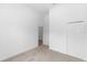 Bedroom showcasing a closet and an open doorway offering a glimpse of the wood floors beyond at 2065 East Pkwy, Deland, FL 32724