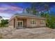 Back of house has three windows and sliding glass doors at 2065 East Pkwy, Deland, FL 32724