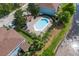 Overhead shot of a community pool with ample seating and clear water at 2288 Leland Ln, Casselberry, FL 32707
