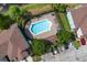 Aerial view of the community pool and lounge area surrounded by lush landscaping at 2288 Leland Ln, Casselberry, FL 32707