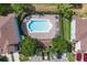 Aerial view of community pool area featuring lounge chairs and shade for residents at 2288 Leland Ln, Casselberry, FL 32707